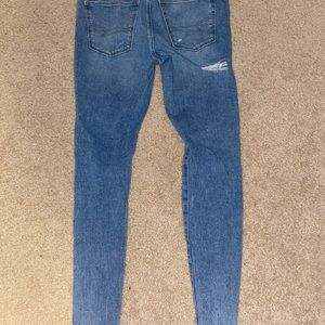 American eagle skinny jeans, size 8 long, light colored, distressed.